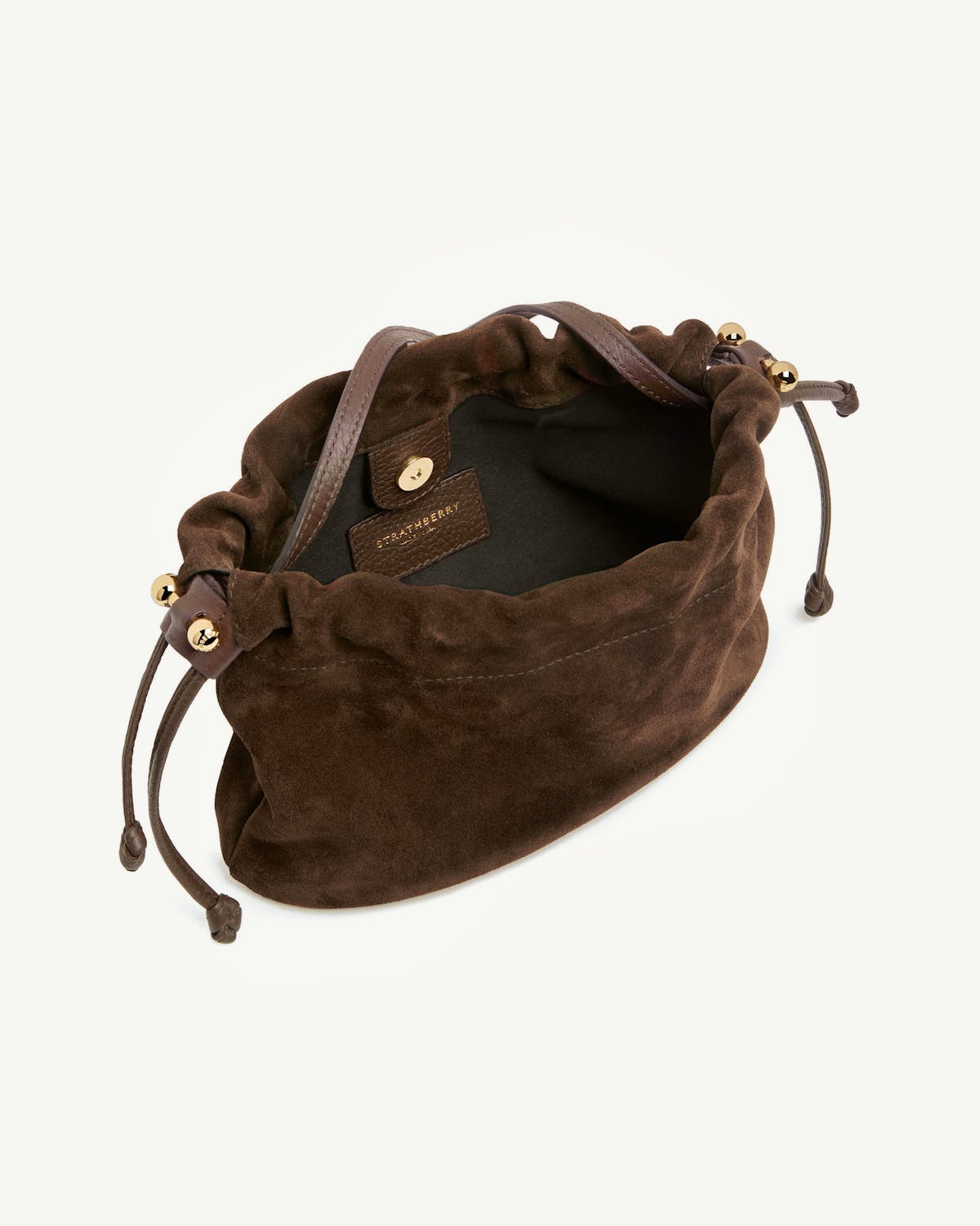Strathberry chocolate suede Charlotte drawstring bag with leather strap and gold beads.
