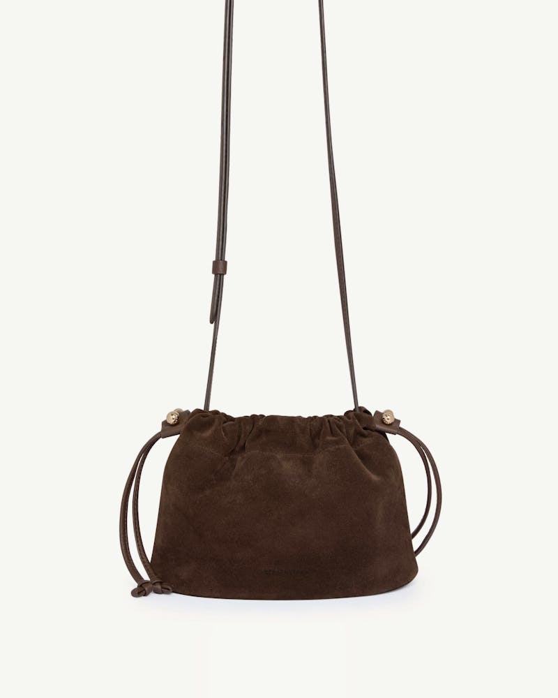 Strathberry Charlotte drawstring bag in chocolate suede with long strap.
