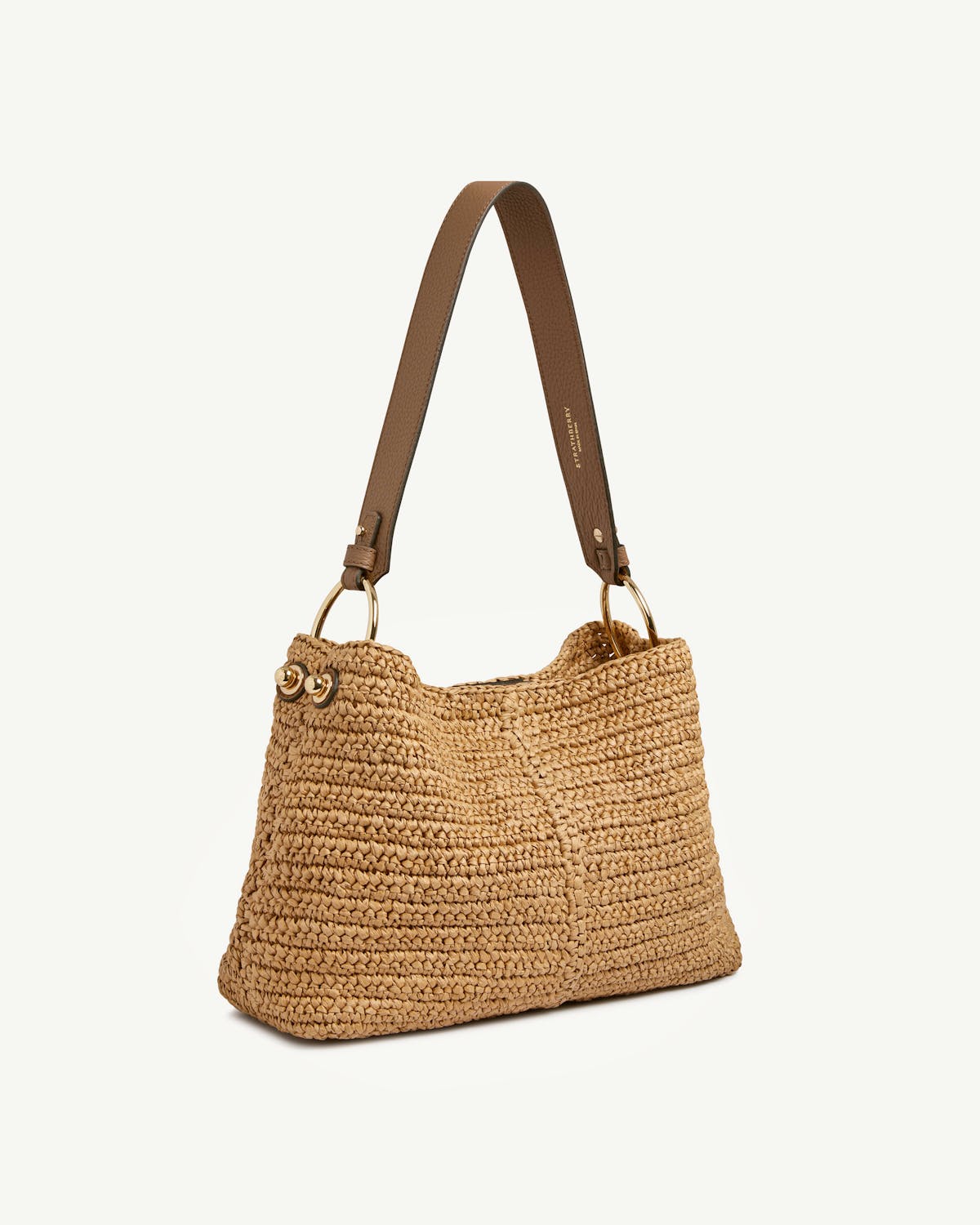 Raffia woven hobo bag with clay leather shoulder strap and gold ring fittings.