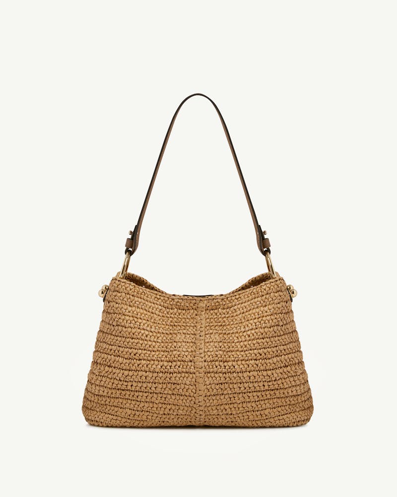 Raffia and clay woven hobo bag with single brown leather shoulder strap and gold hardware.