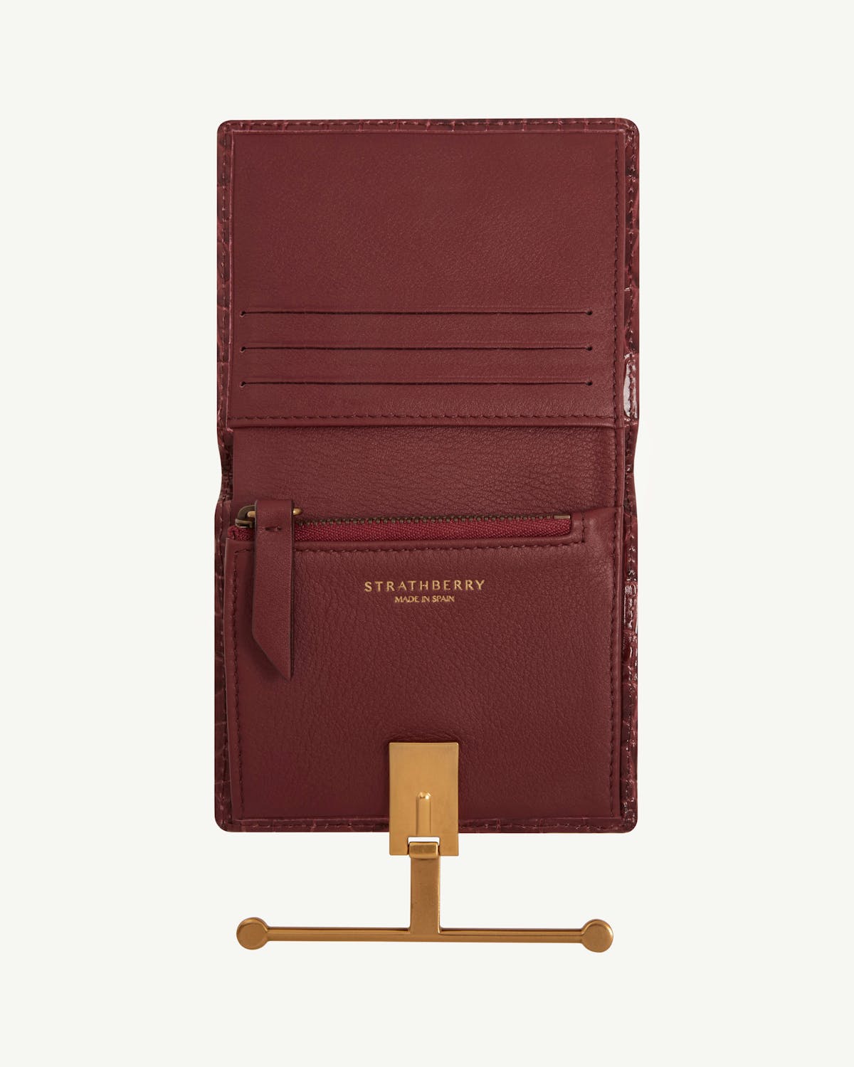 Strathberry Melville Street Wallet croc in burgundy, open showing card slots and gold clasp