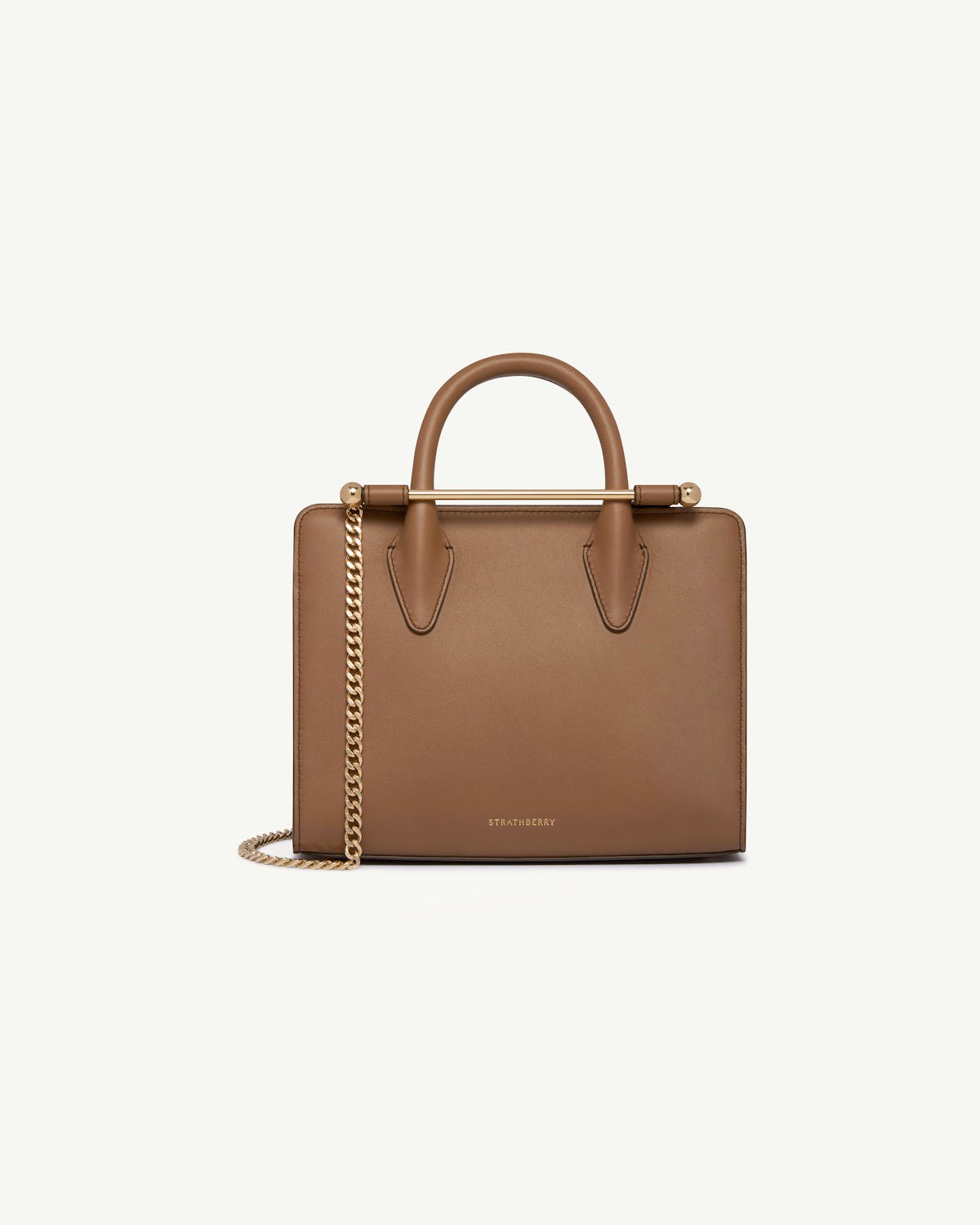 Strathberry mini tote in clay with gold chain and top handles.
