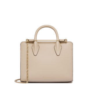 Oat mini tote with top handles and gold chain strap on plain background