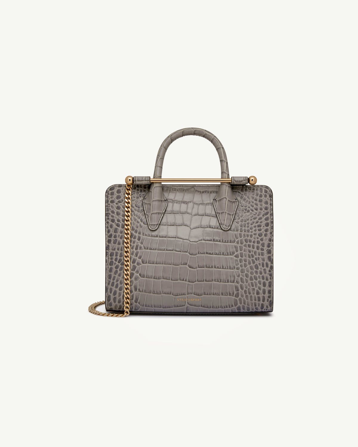 Strathberry mini tote in soft croc grey with gold chain and top handle.
