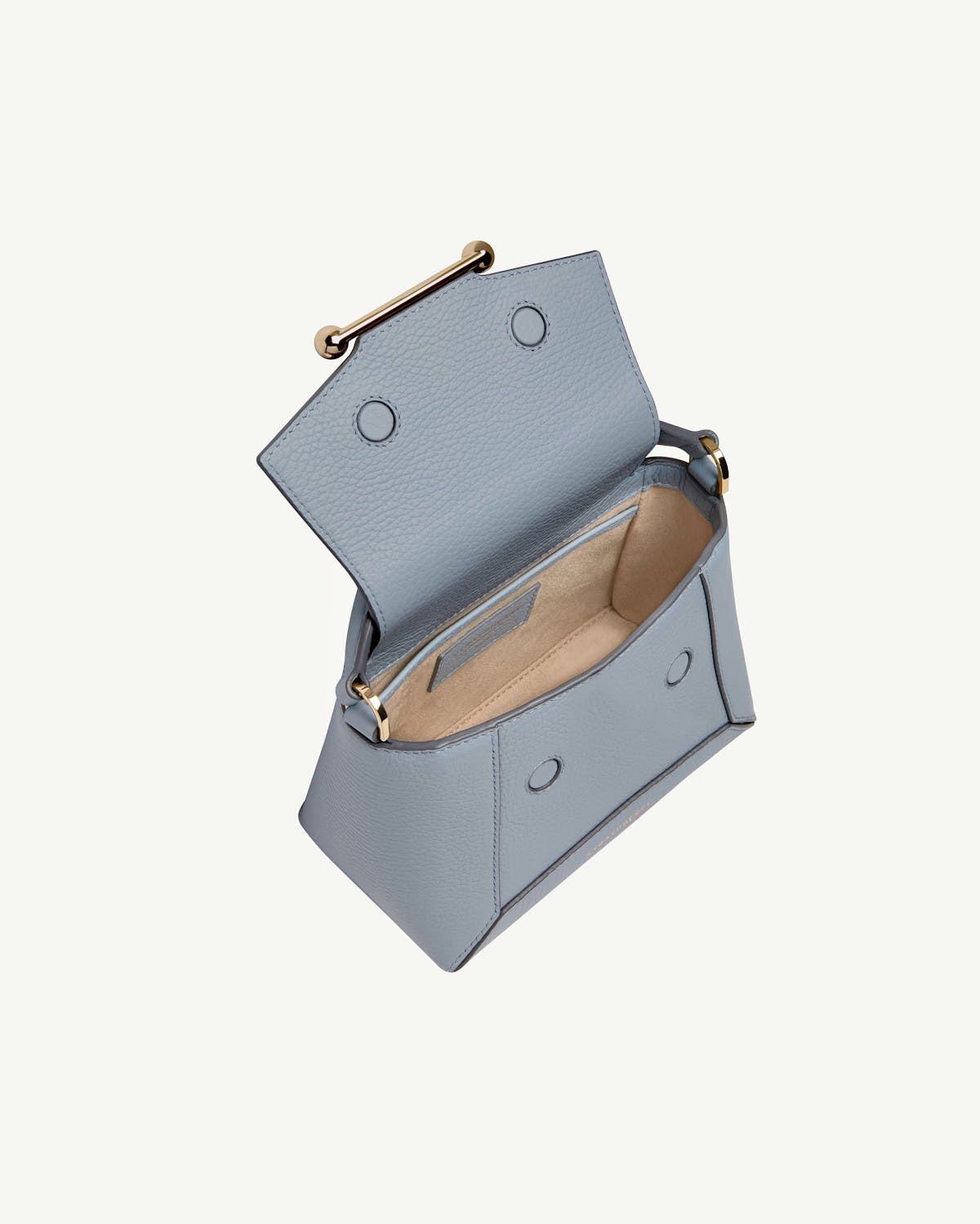 Dusky blue Mosaic Nano bag with open flap showing beige interior.