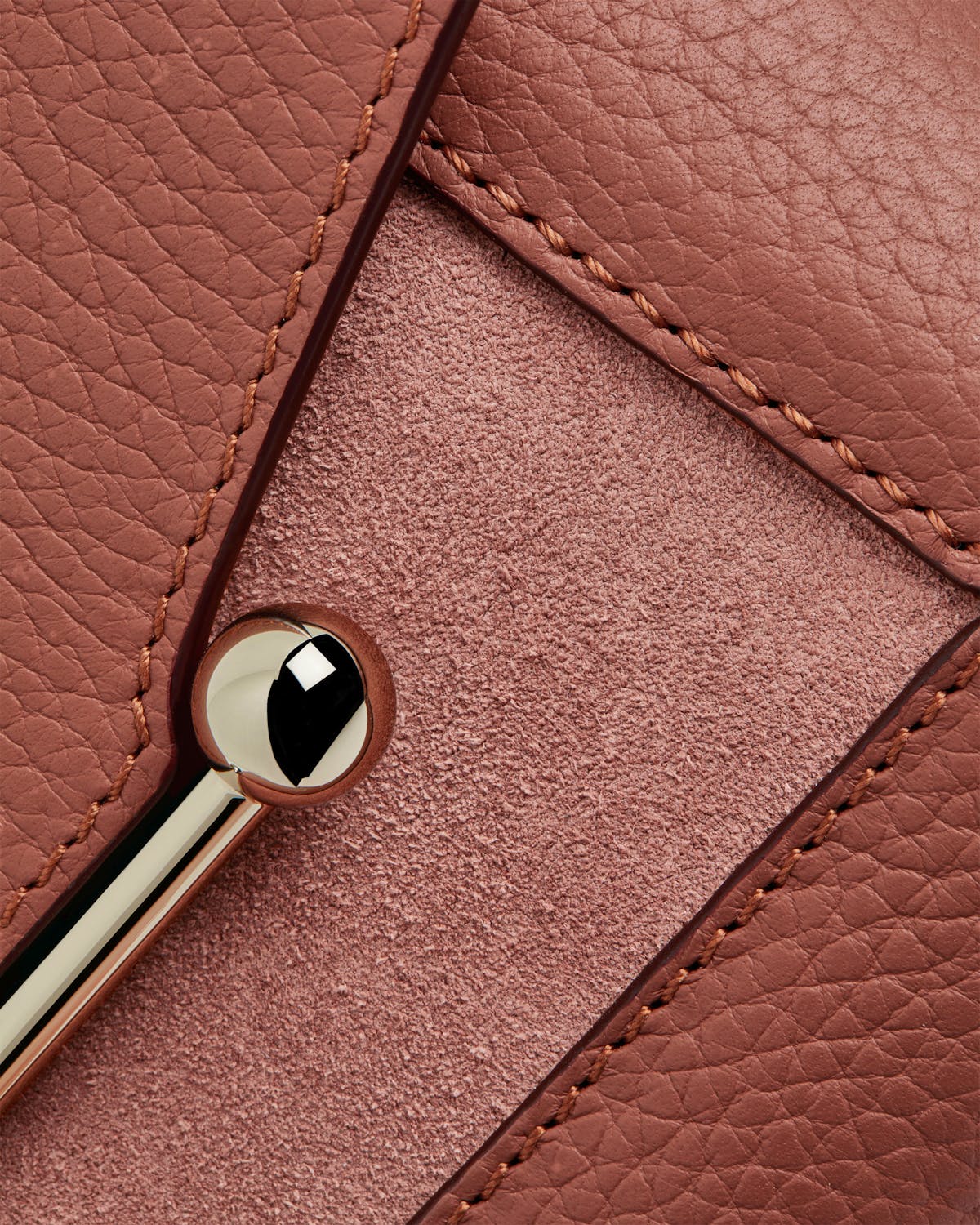 Mosaic Nano sienna dusty pink suede bag with pebbled leather, suede panel and metal bar.