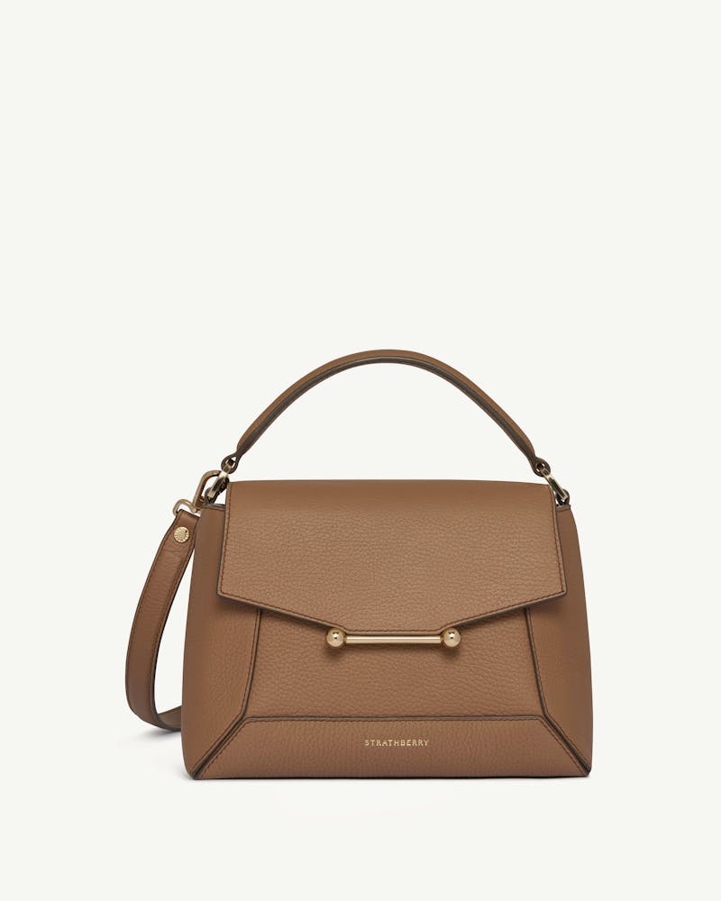 Strathberry clay mosaic bag with top handle, gold bar closure, and shoulder strap.