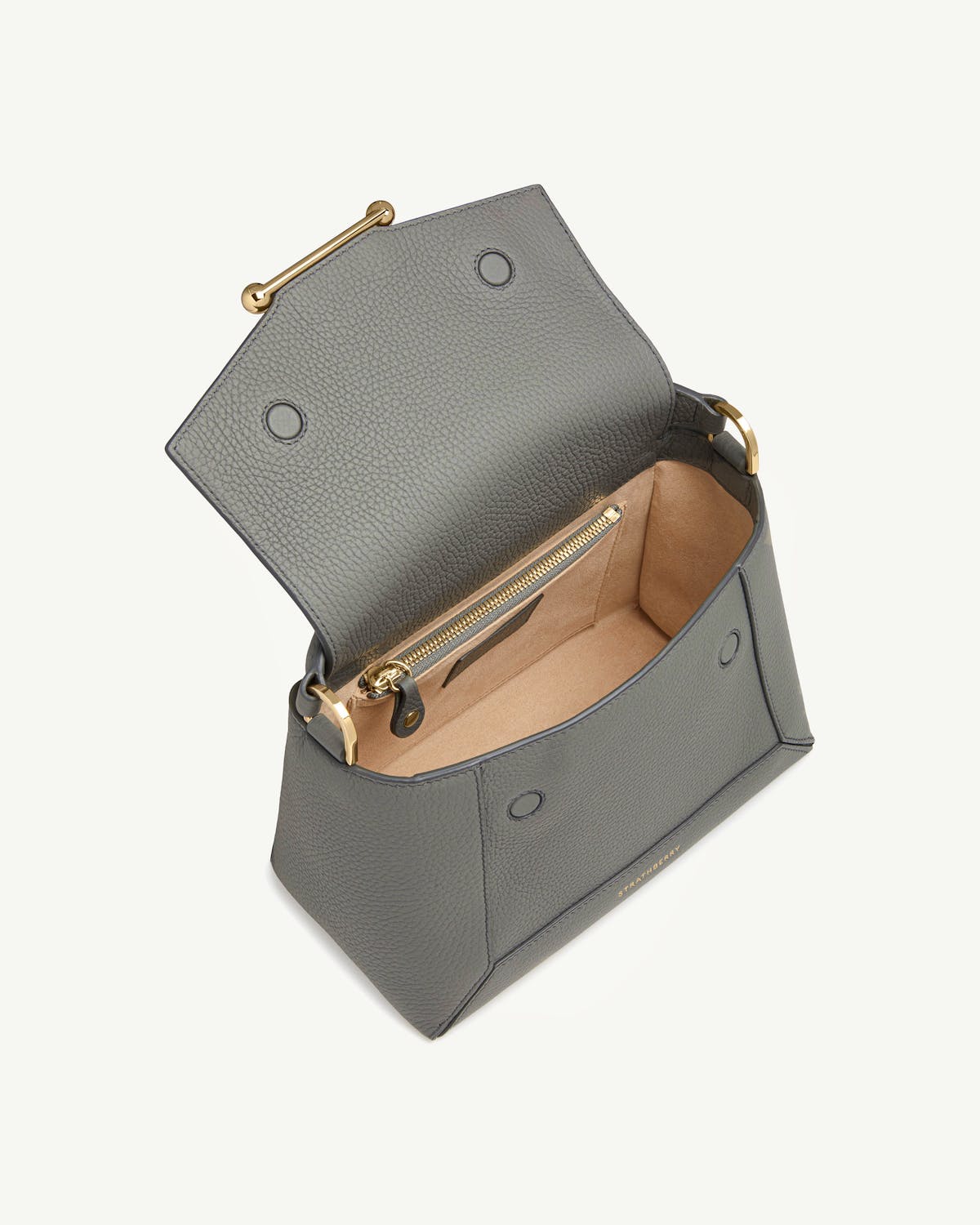 Stone grey Strathberry mosaic bag open, showing tan interior and gold hardware.