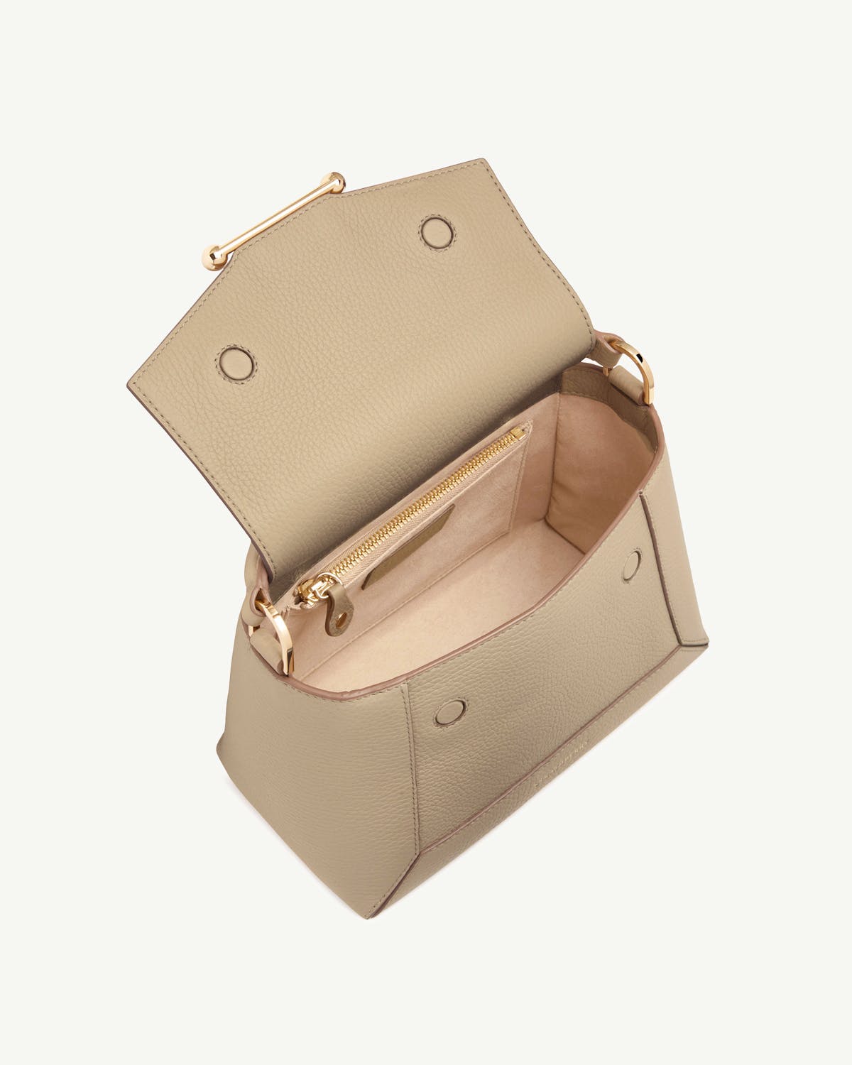Sand mosaic bag with pebbled exterior open, showing soft lining, zip pocket, magnetic snaps.