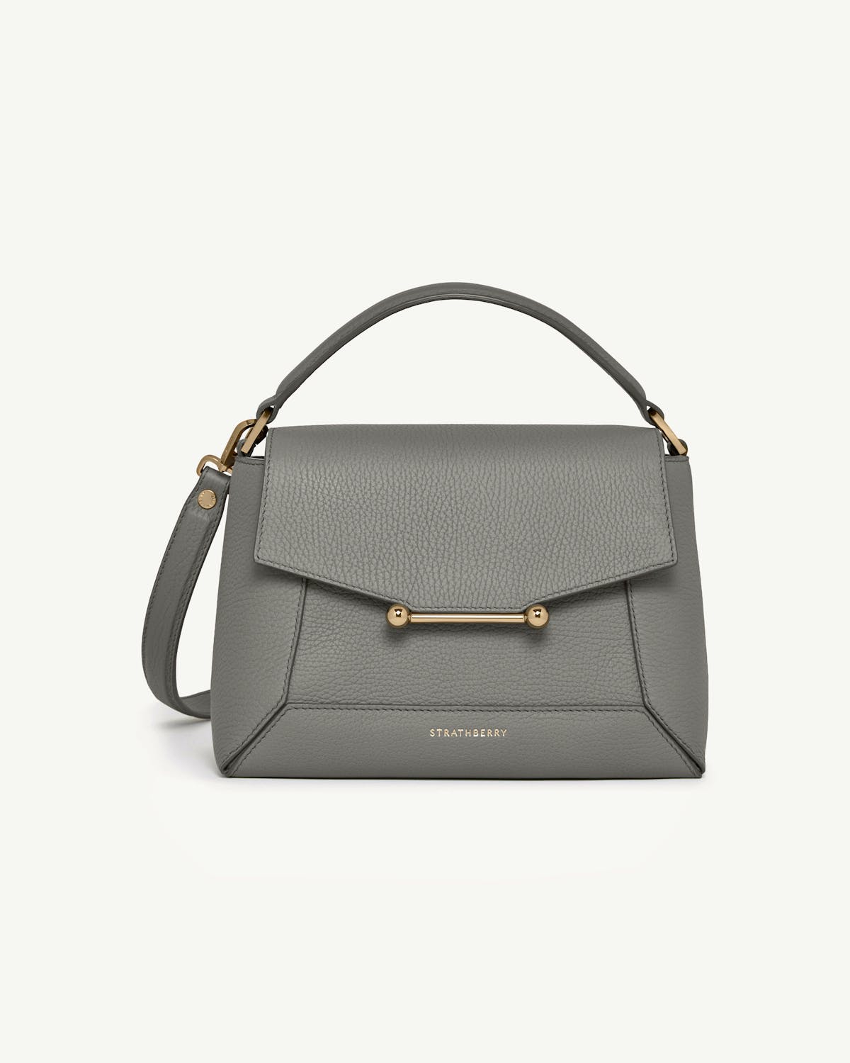 Stone grey mosaic bag with top handle and gold bar hardware, Strathberry logo.