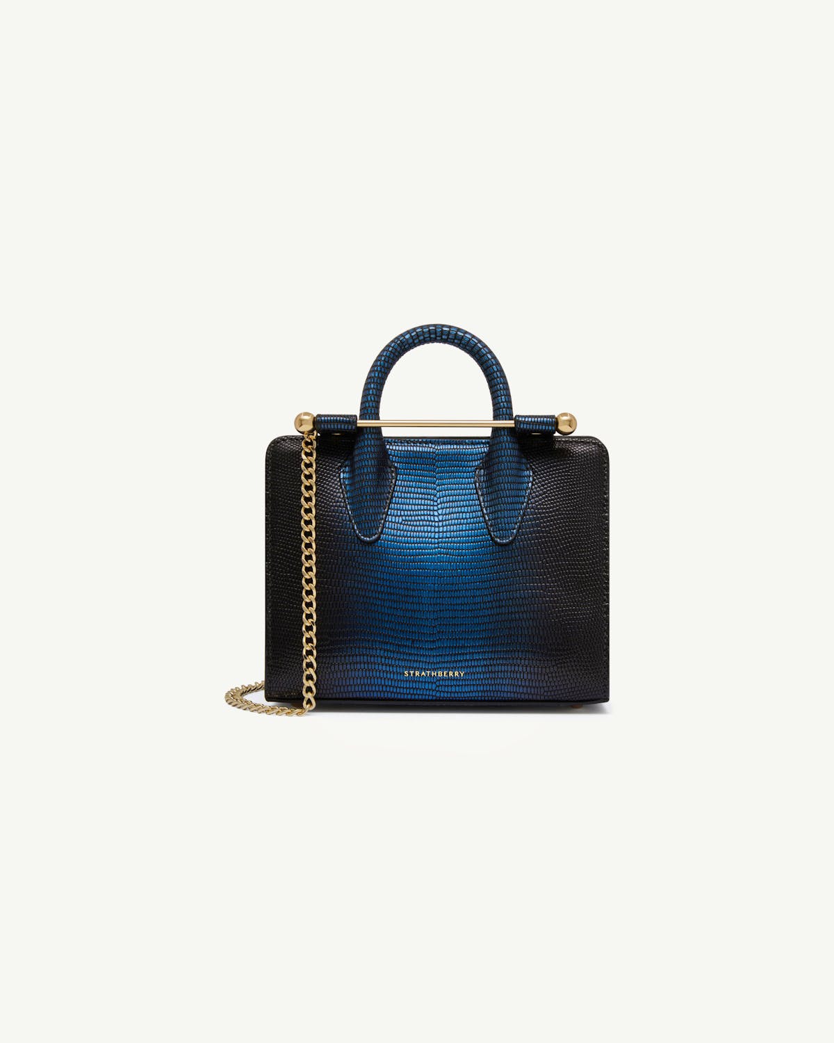Strathberry Nano Tote in lizard-embossed blue with gold bar handle and chain strap