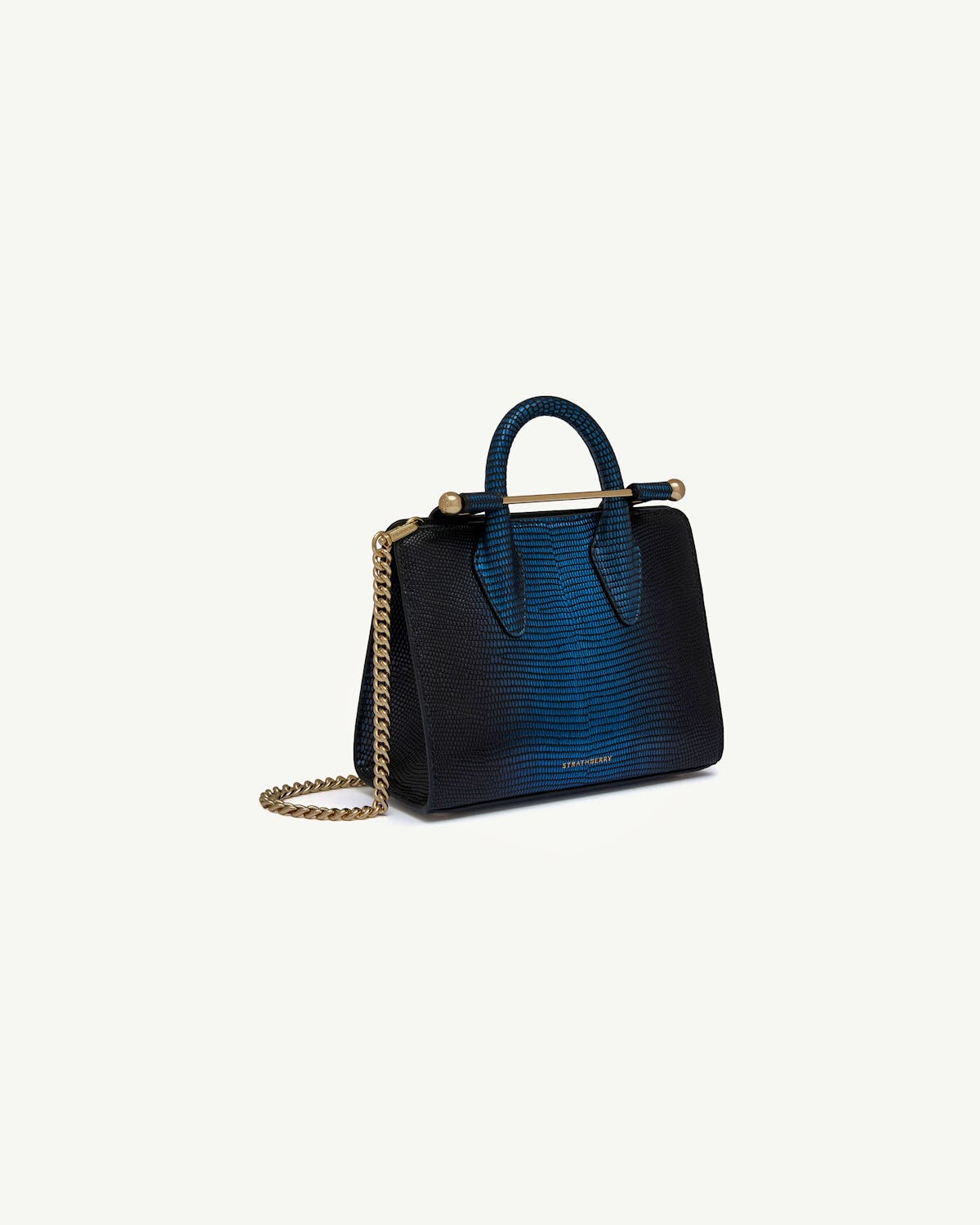 Strathberry lizard-effect nano tote in blue-black with gold chain strap.