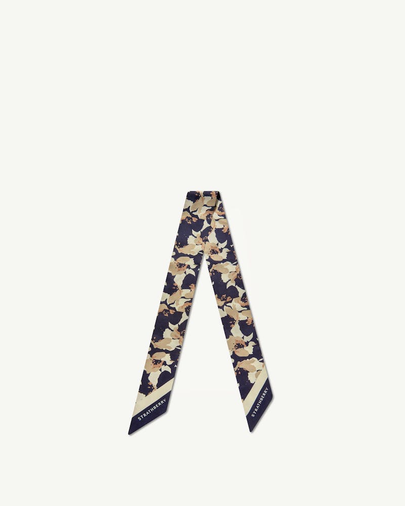 Silk skinny scarf with abstract navy and sand floral print, Strathberry logo.