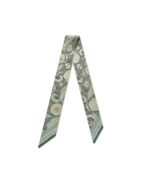 Silk skinny scarf in sage arcade print arranged in a V shape.