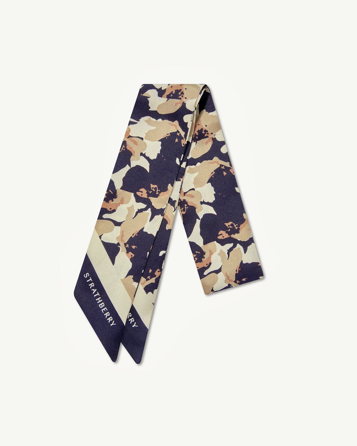 Strathberry silk skinny scarf with abstract navy and sand floral print.
