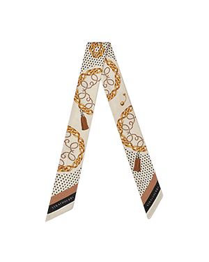 Black and tan chain-print skinny scarf with polka-dot background and striped ends.