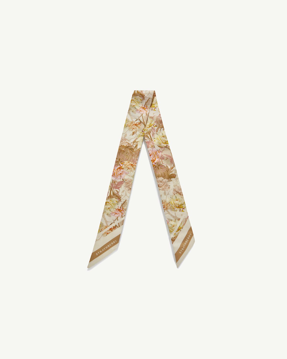 Silk skinny scarf with vanilla and pink floral print, Strathberry logo at the ends.