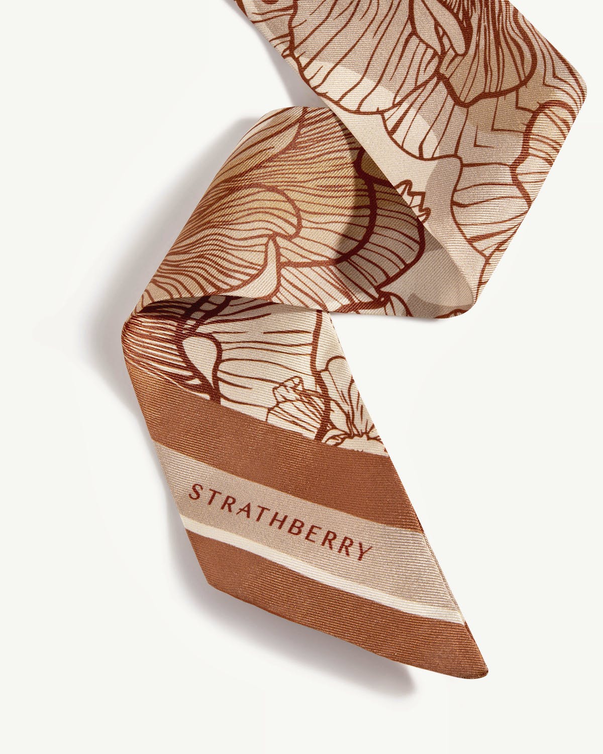 Chestnut and vanilla floral skinny silk scarf with Strathberry logo visible.