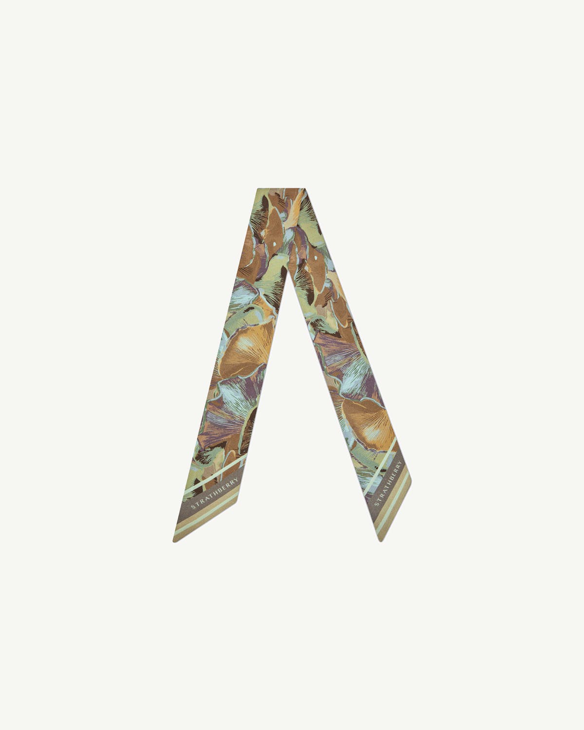 Silk skinny scarf in oat mushroom print, folded into a V, Strathberry logo visible.