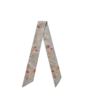 Silk skinny scarf in marble grey with framed floral print, folded in V.