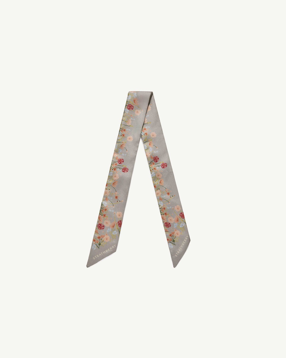 Marble grey silk skinny scarf with floral print and Strathberry logo at tips.