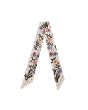Vanilla silk skinny scarf with forest green thistle print and Strathberry logo on the ends.