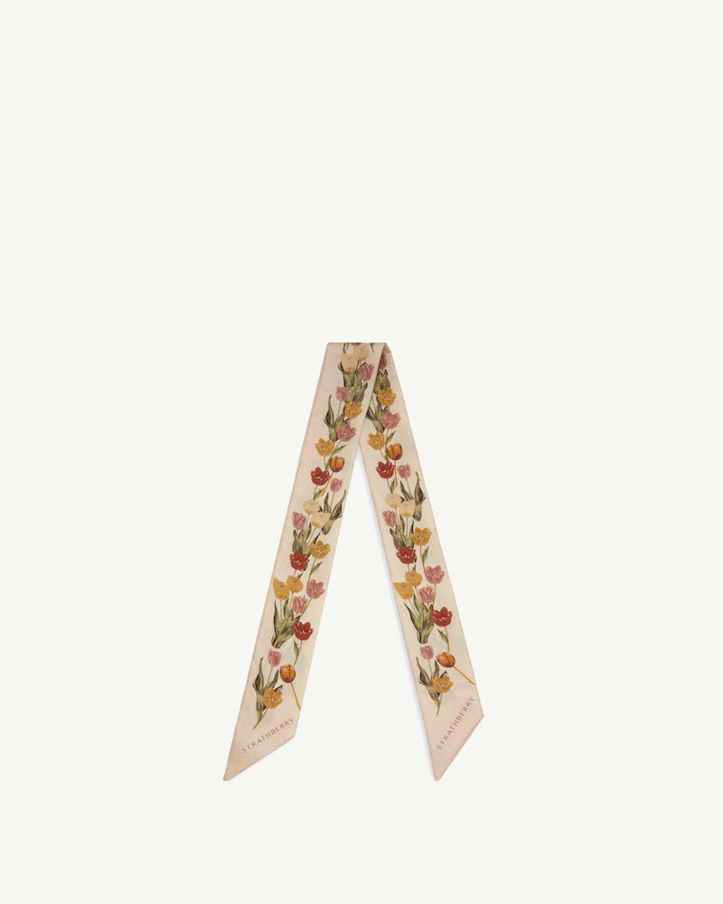 Vanilla silk skinny scarf with brûlée tulip print and Strathberry logo.