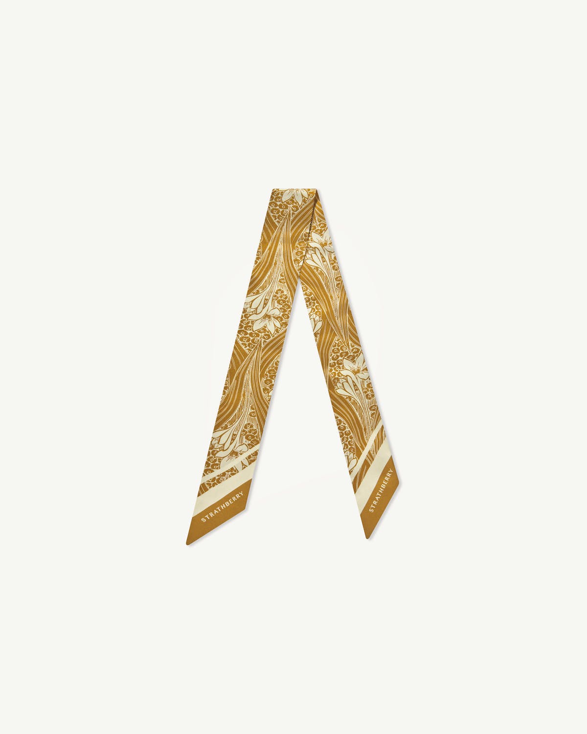 Mustard wallpaper print silk skinny scarf with floral pattern and Strathberry wordmark on ends.
