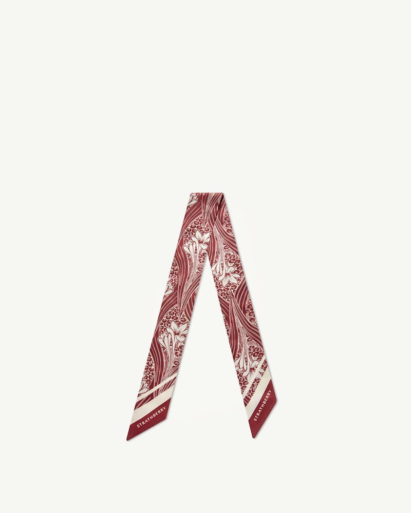 Oxblood wallpaper-print silk skinny scarf arranged in a V shape, Strathberry logo visible