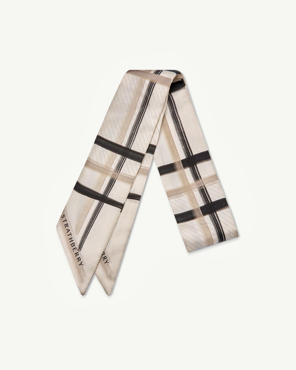 Sand and vanilla tartan silk skinny scarf folded with visible Strathberry logo
