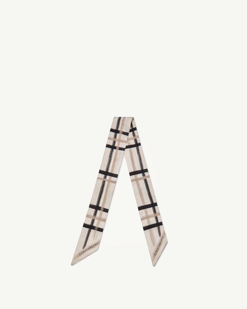 Strathberry silk skinny scarf in sand and vanilla tartan with black grid.