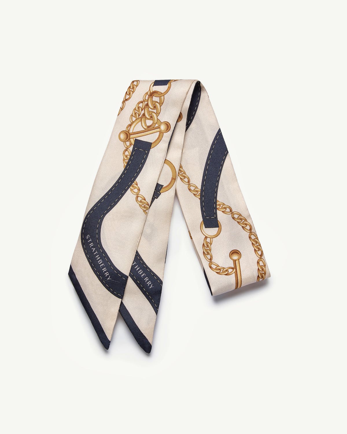 Navy and vanilla silk skinny scarf with belt and chain print, Strathberry logo.