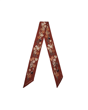 Oxblood silk skinny scarf with tulip print along its length, tapered ends.