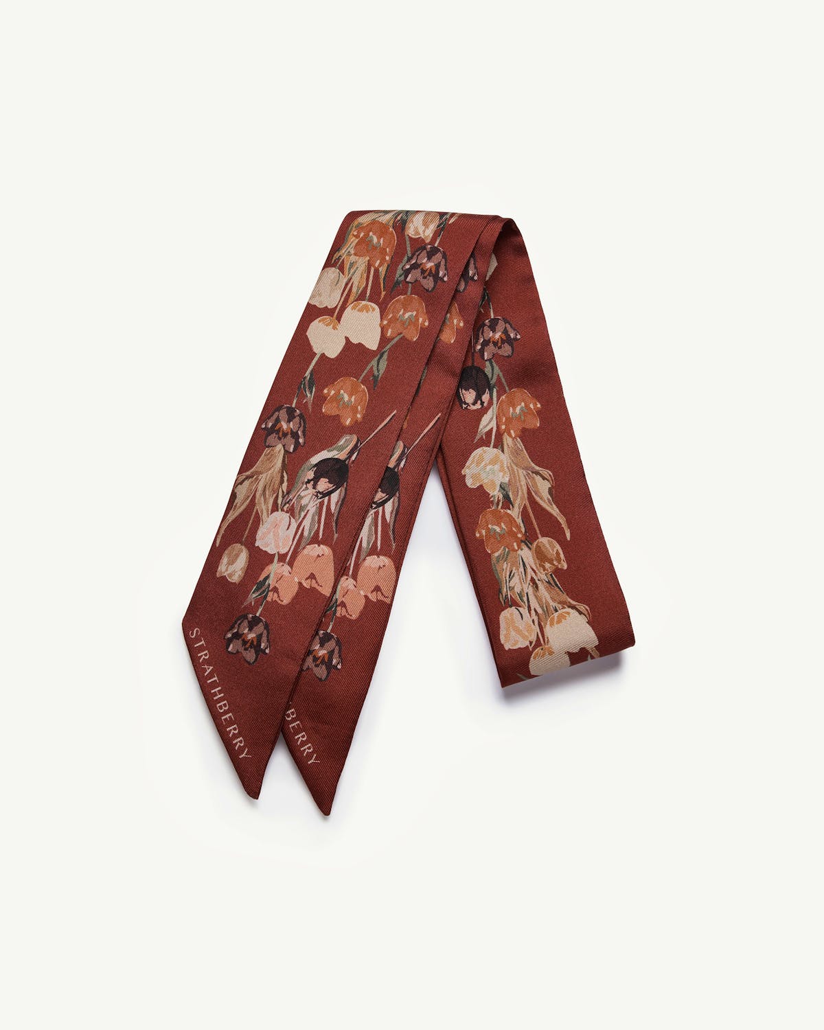 Oxblood silk skinny scarf with tulip print and Strathberry logo.
