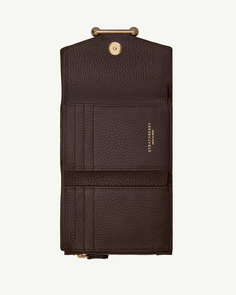 Open Strathberry mosaic trifold wallet in espresso leather showing card slots and zip pocket.