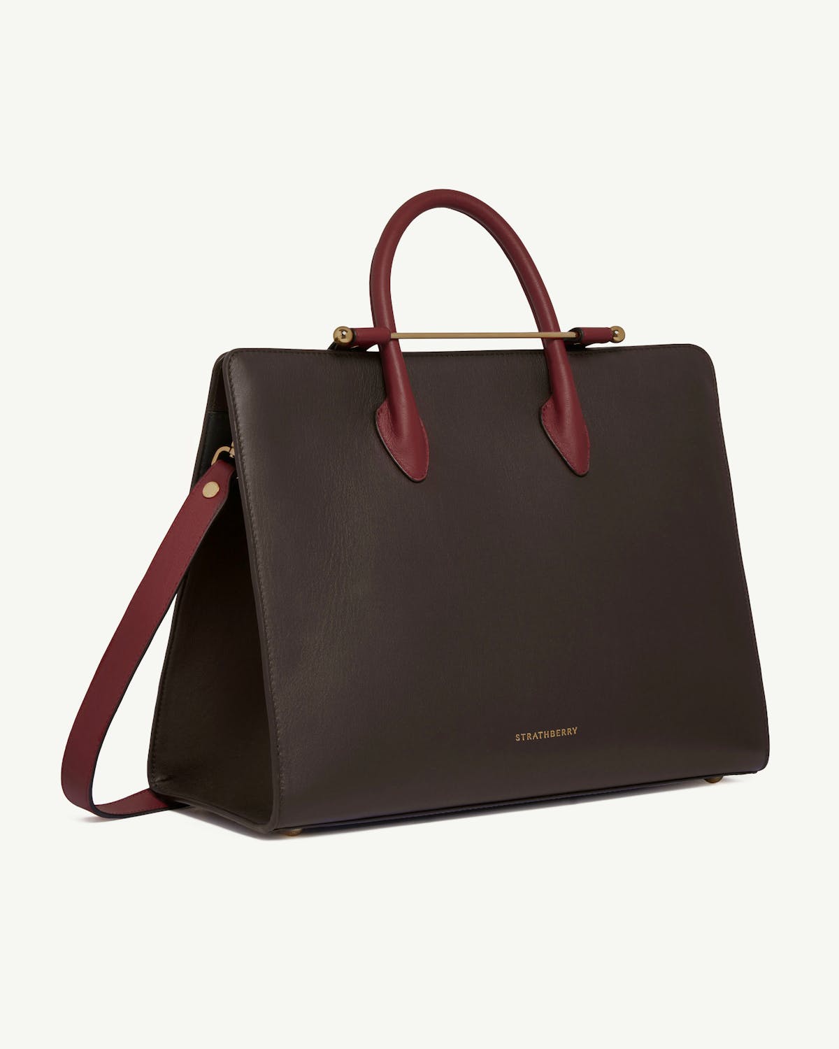 Strathberry leather tote in espresso with oxblood handles and strap, gold hardware.