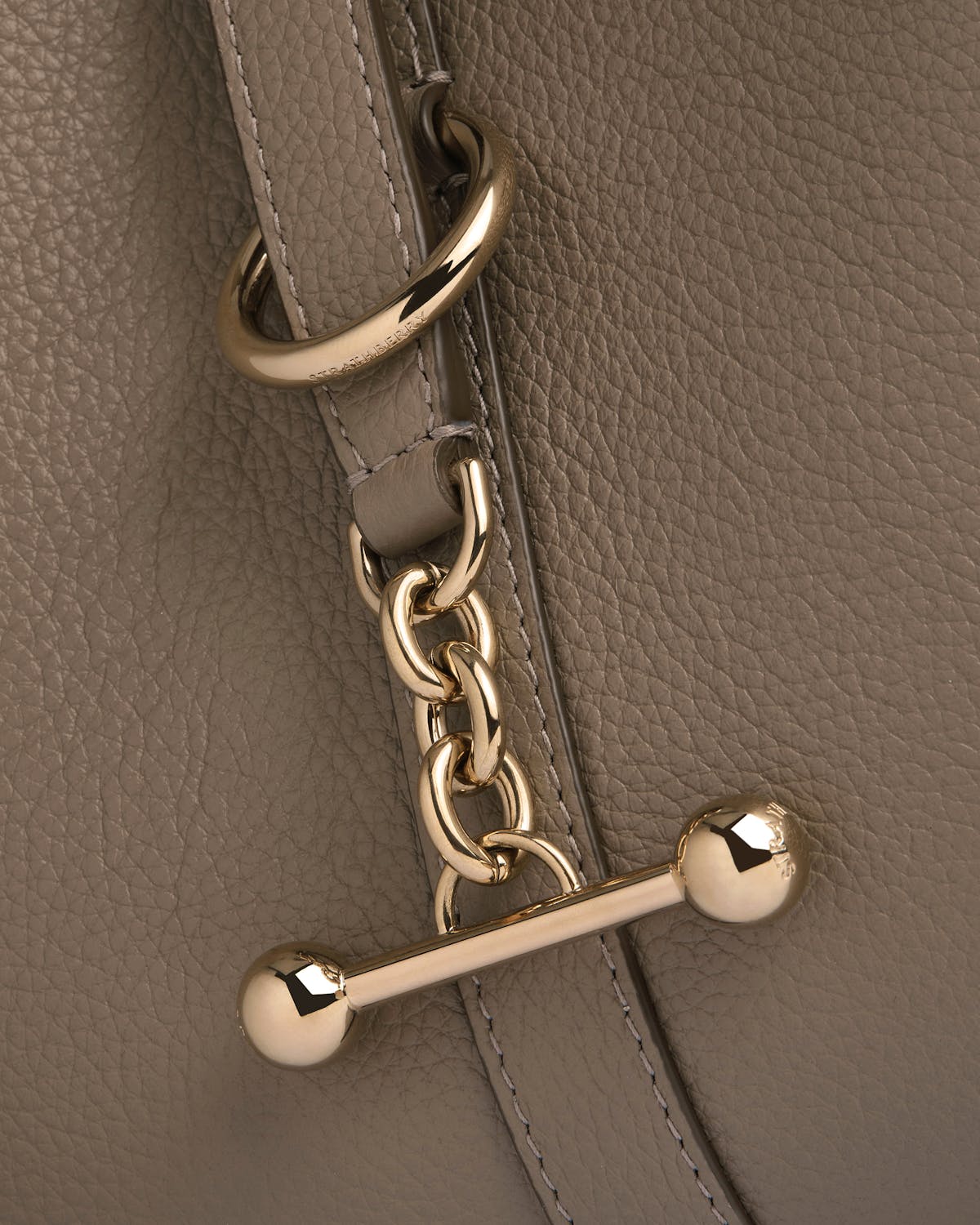 Taupe pebbled leather strap with gold chain and bar hardware