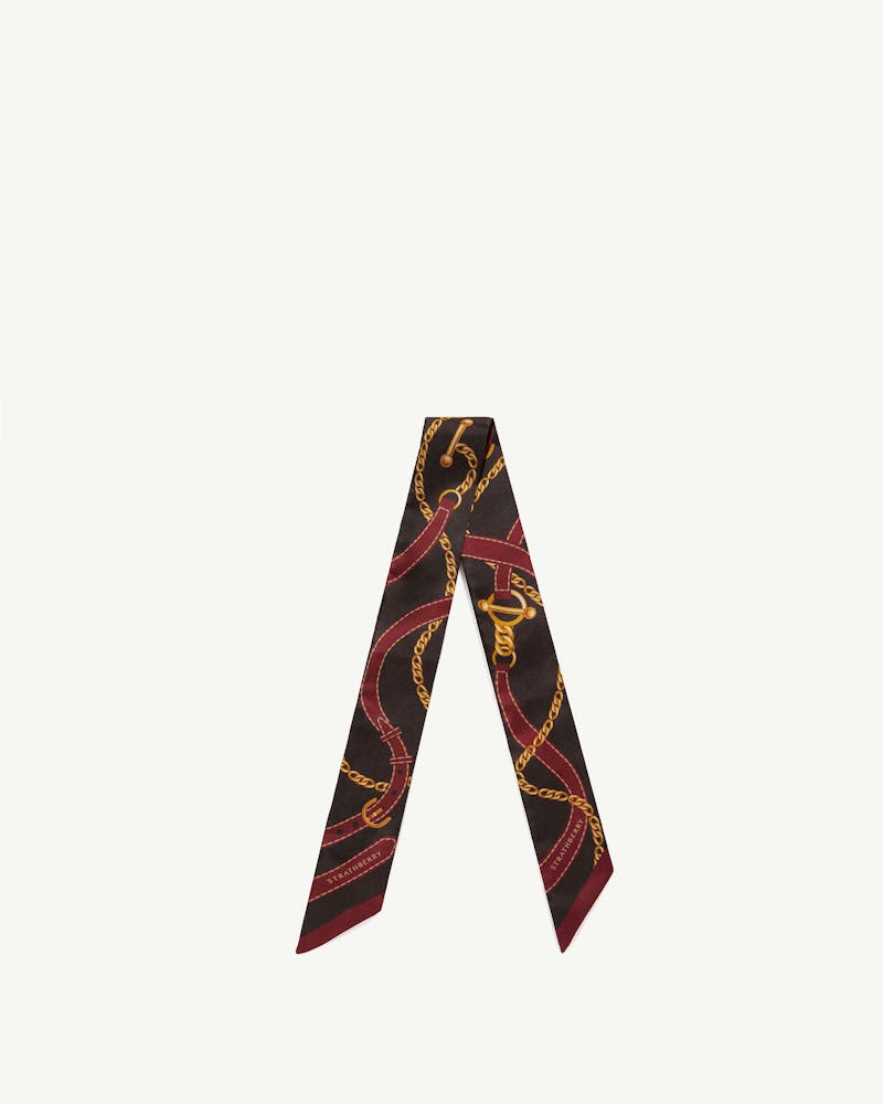 Silk skinny scarf in oxblood and espresso with belt and chain print by Strathberry