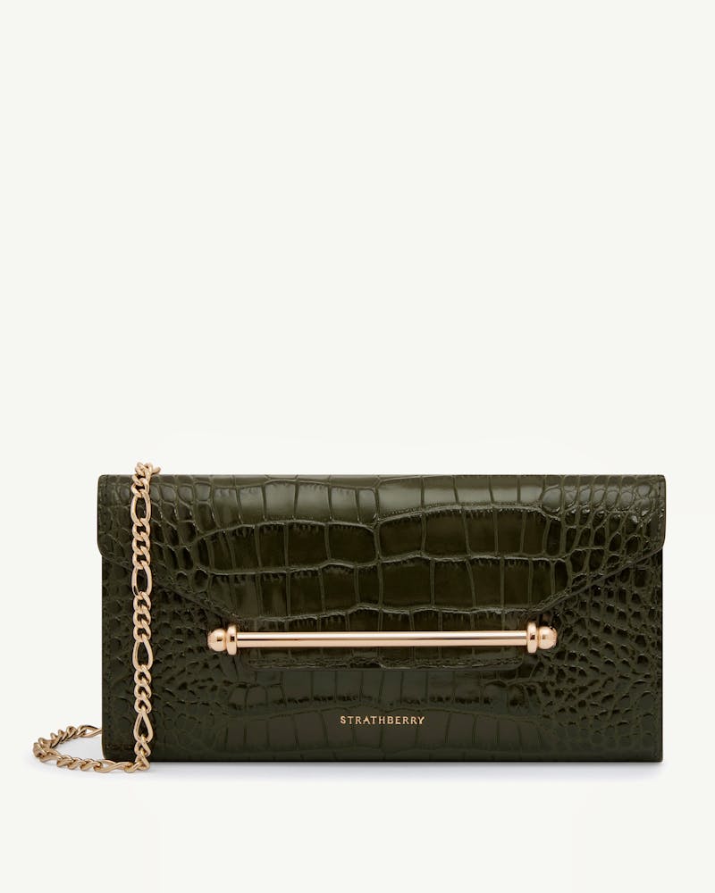 Strathberry Multrees chain wallet in croc-embossed leather with gold bar and chain.
