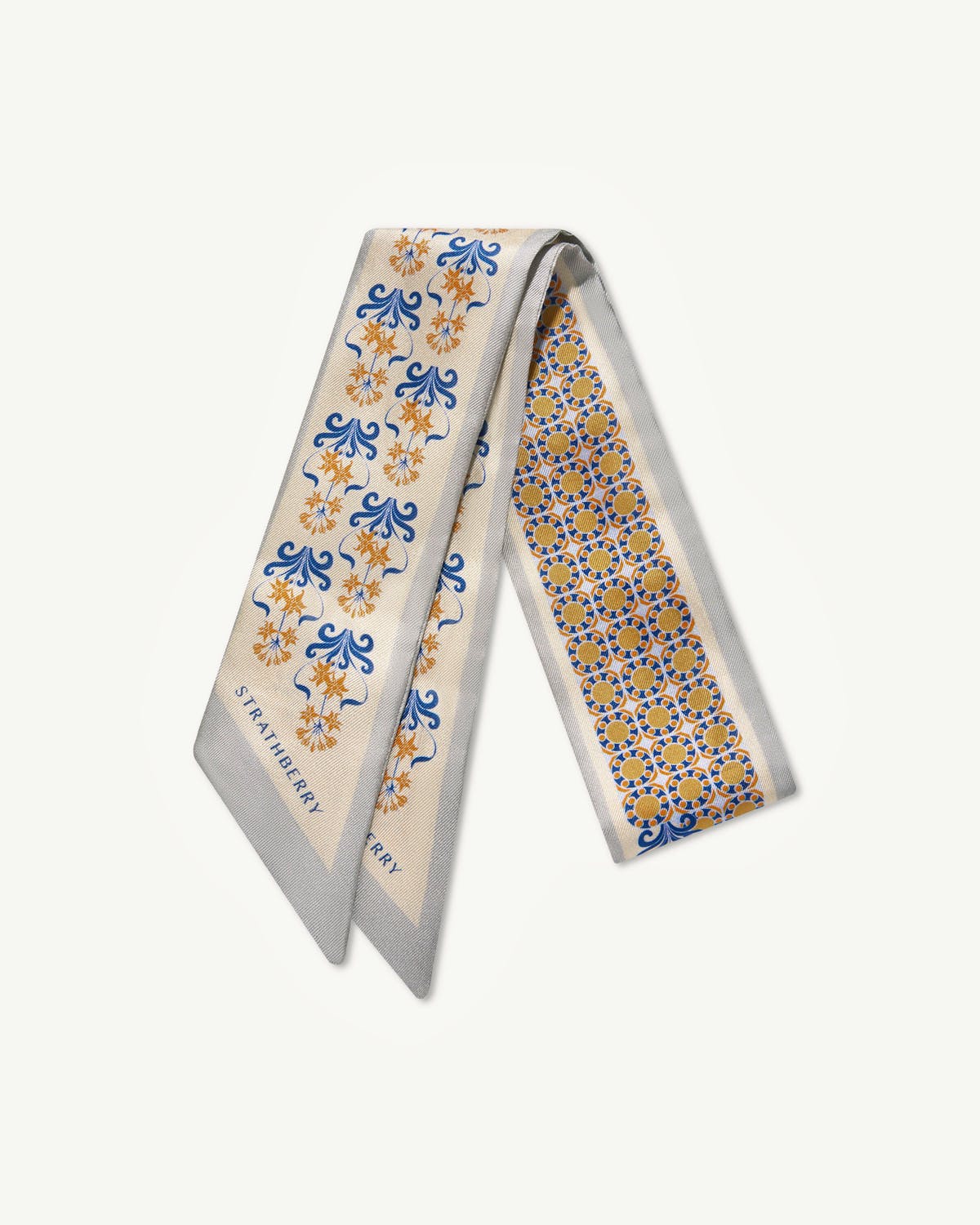 Silk skinny scarf in marble grey and brûlée geometric tile pattern, Strathberry.