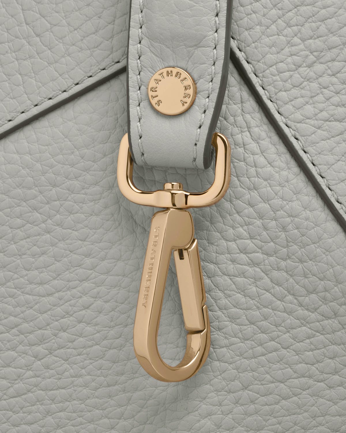Gold Strathberry clasp and leather strap on marble grey mosaic bag.