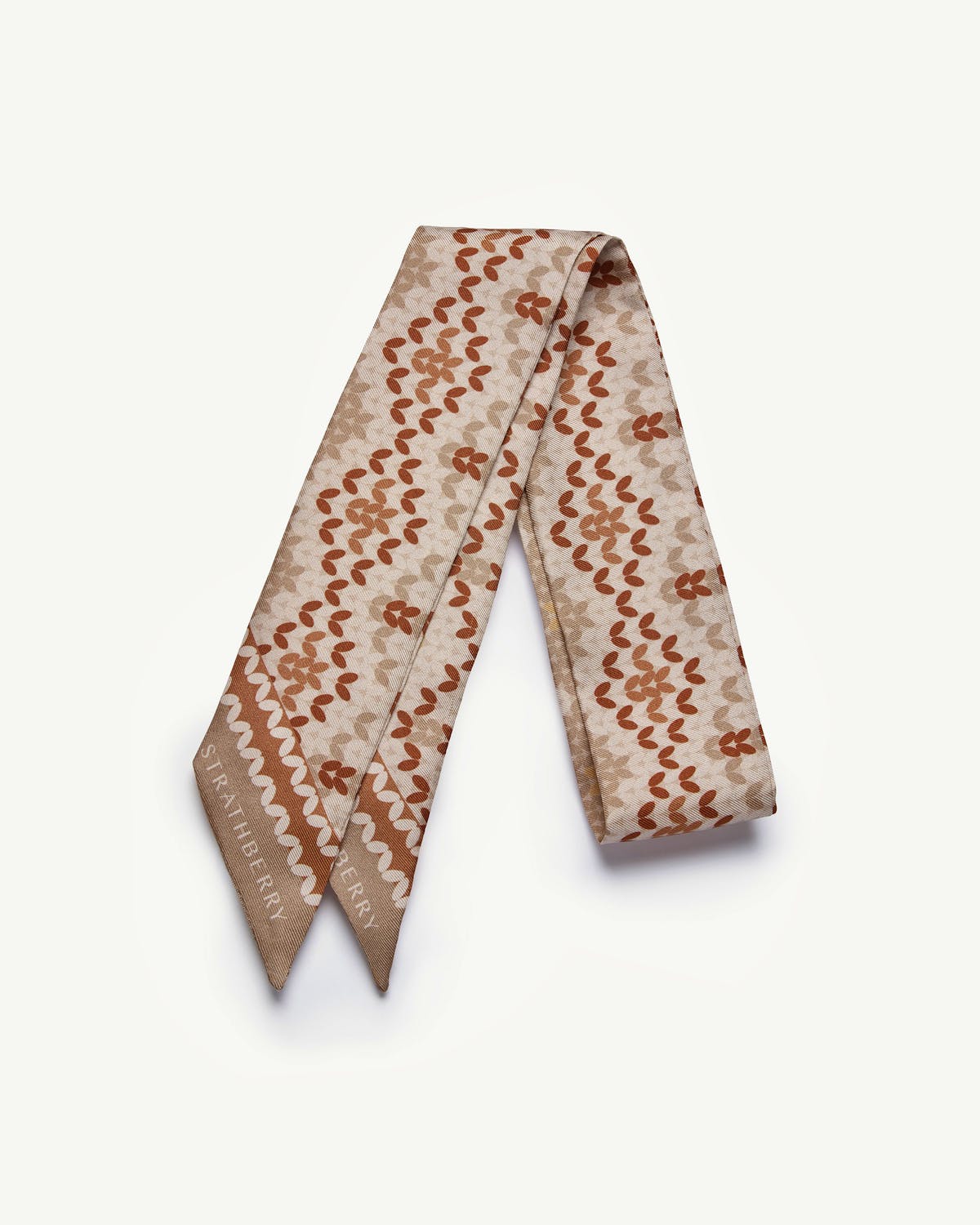 Brûlée Fair Isle silk skinny scarf with leaf pattern and Strathberry logo.