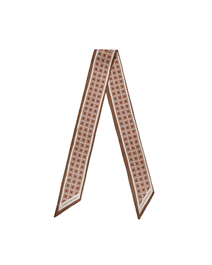 Tan silk skinny scarf with repeating geometric print and pointed ends.
