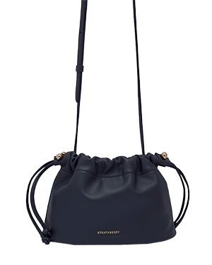 Marine blue Charlotte drawstring bag with long shoulder strap and gold Strathberry logo.