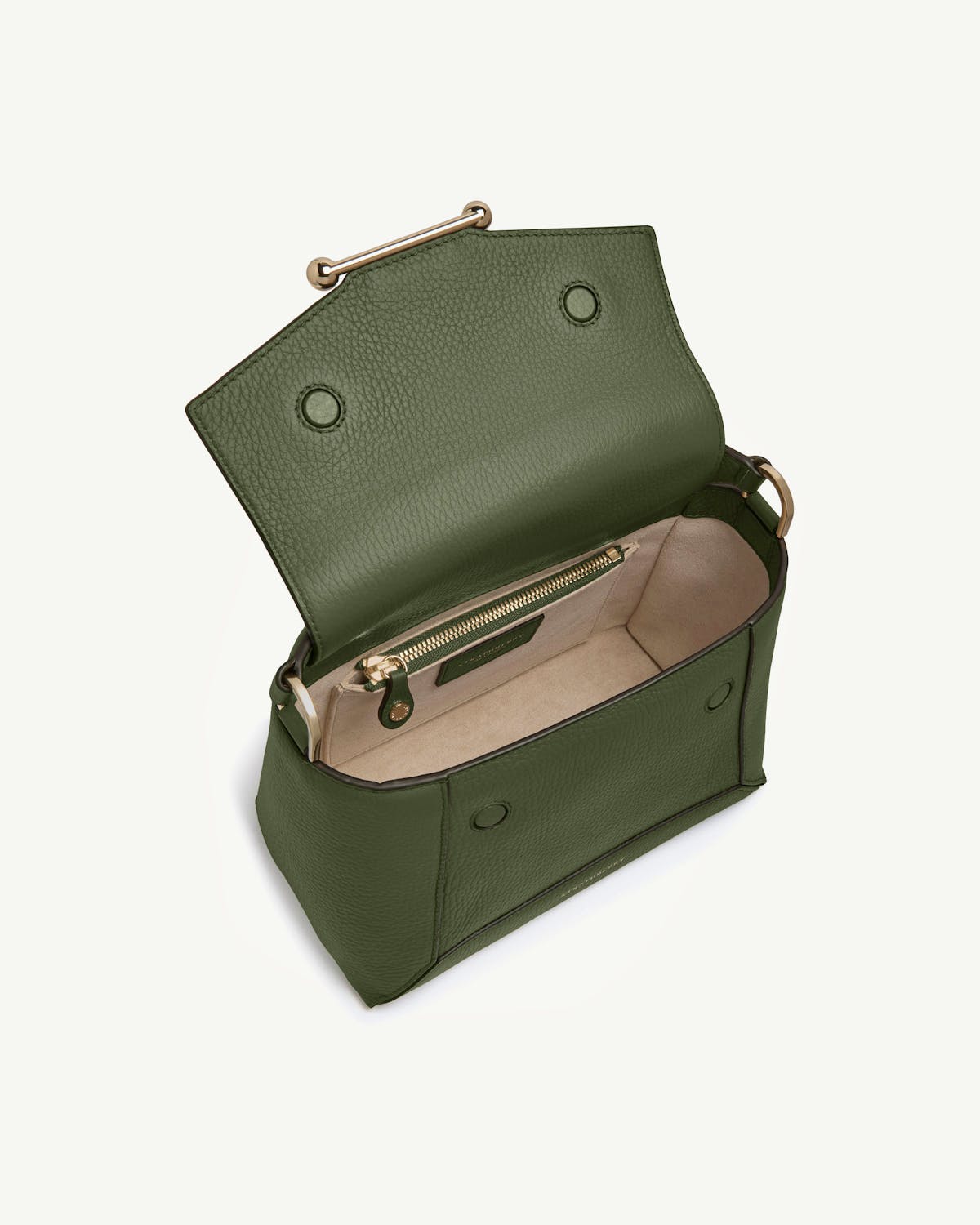 Open pine green mosaic bag with beige interior and gold zip pocket