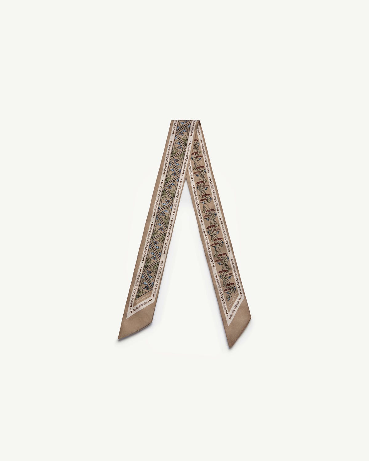 Silk skinny scarf in caramel with narrow geometric pattern and pointed ends.