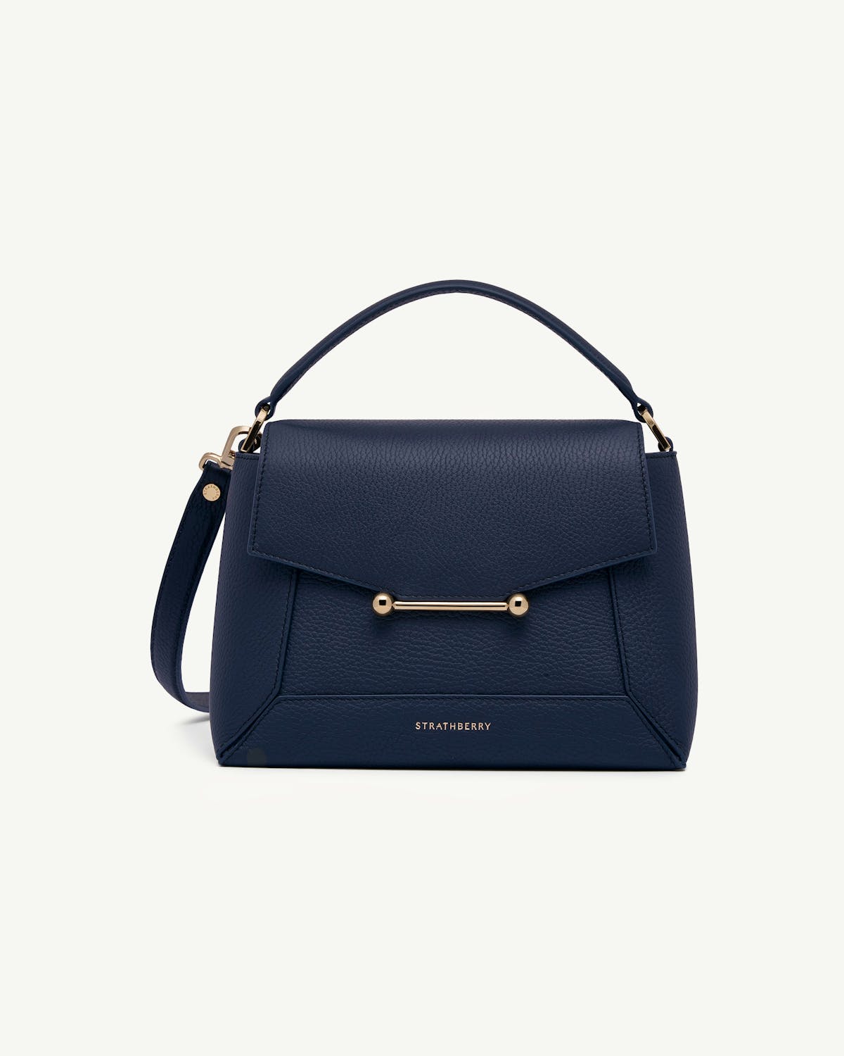 Navy Strathberry mosaic bag with top handle, gold bar closure, detachable shoulder strap.
