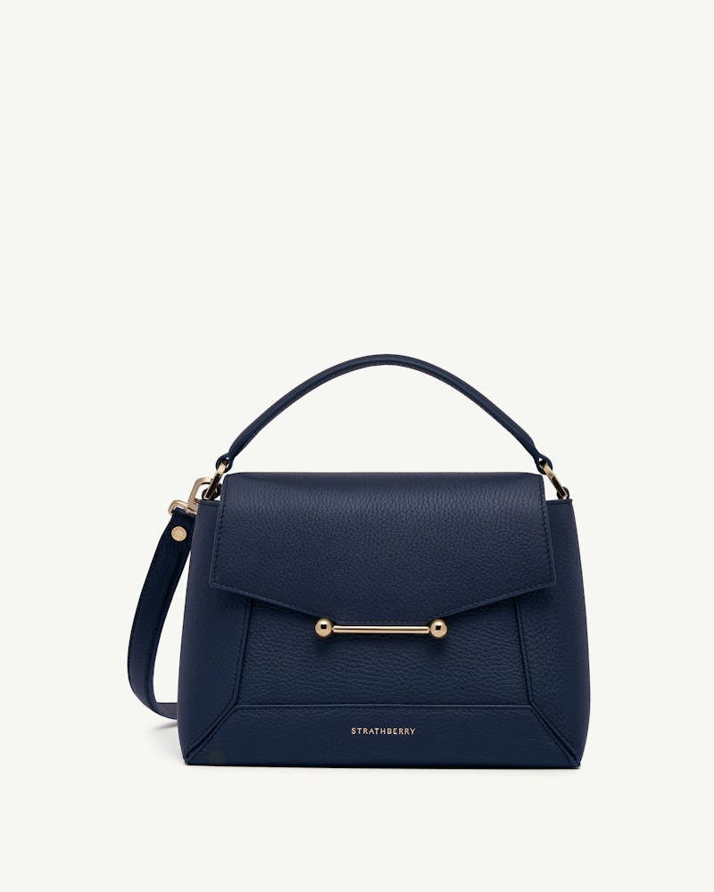 Navy Strathberry Mosaic bag with top handle, detachable strap and gold bar.