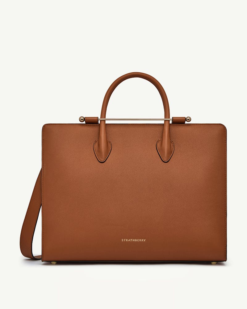 Chestnut leather Strathberry tote bag with top handles and gold bar
