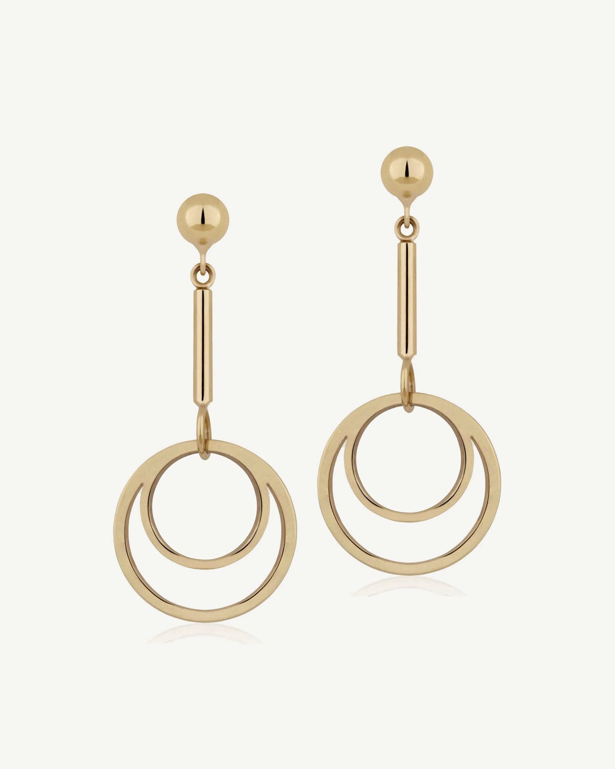 Pair of 22 carat gold-gilded circle drop earrings with two concentric rings.